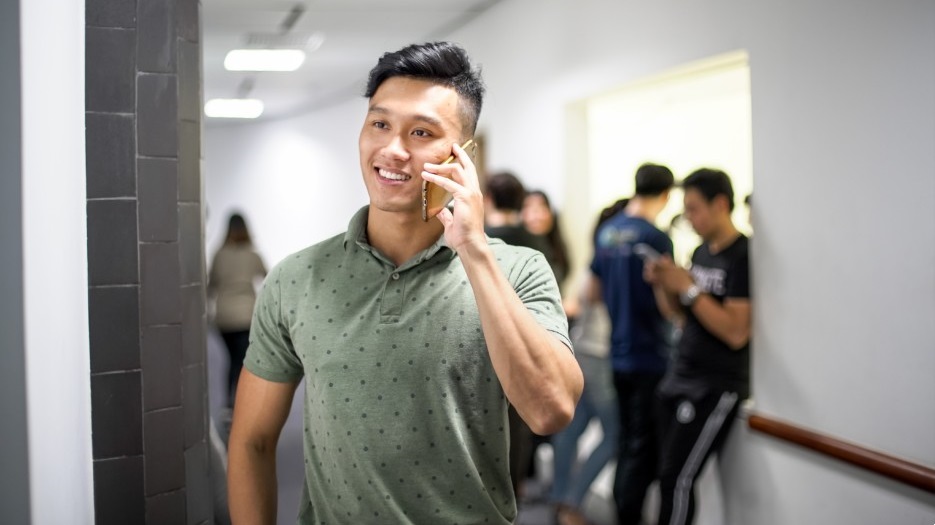 young Vietnamese man on the phone